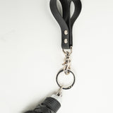 Black rubber finger flogger handle close up on a white background