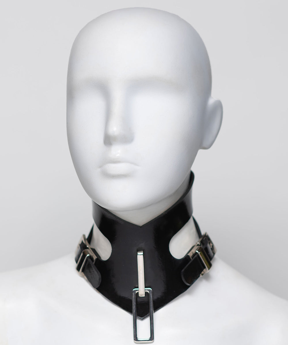 Black leather choker with metal accents on a mannequin head against a white background