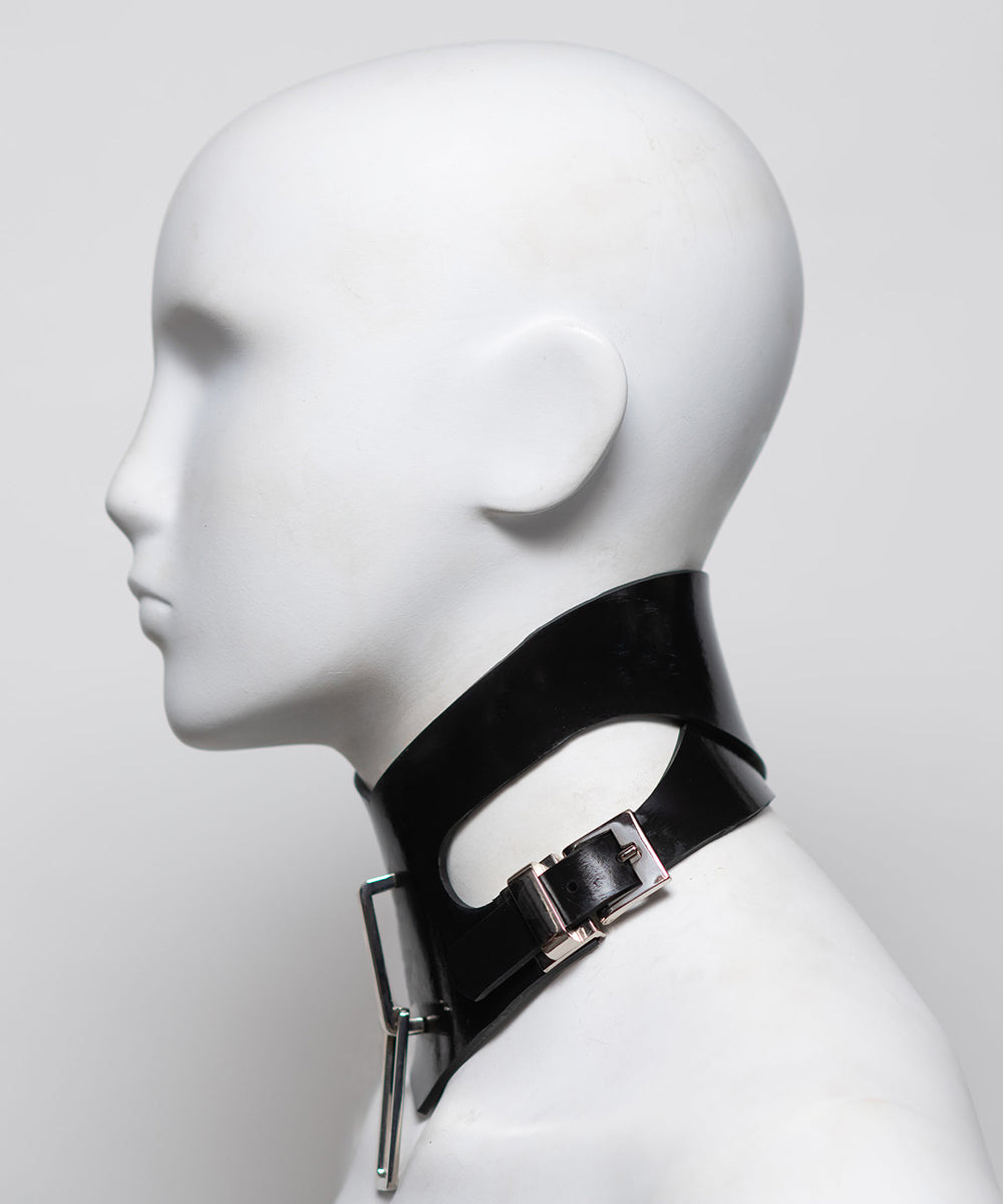 Black leather choker with metal buckle on a mannequin head against a white background