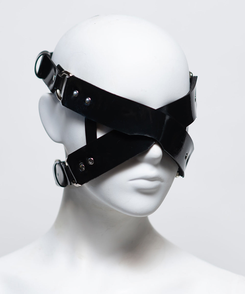 The front of the zafira cross padded blindfold is shown on a white mannequin in front of a white background. 