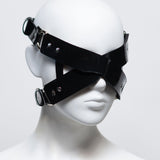 The front of the zafira cross padded blindfold is shown on a white mannequin in front of a white background. 