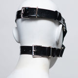 The back of the zafira cross padded blindfold is shown on a white mannequin in front of a white background. 