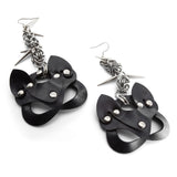 Black cat-shaped earrings with silver accents on a white background