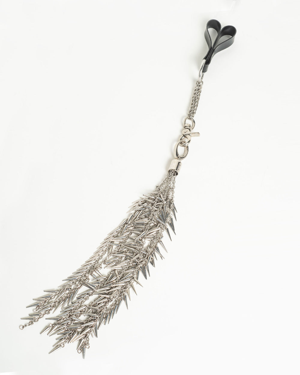 Silver feather-shaped flogger on a white background