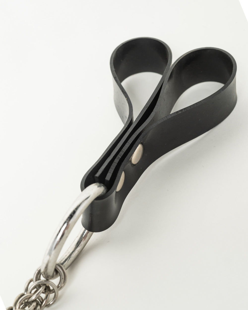 Black Rubber finger handle with a metal ring on a white background