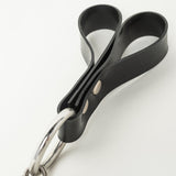 Black Rubber finger handle with a metal ring on a white background