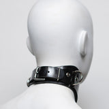 The back of the ilaria double ring posture collar is shown on a white mannequin in front of a gray background.