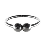 Silver ring with two rounded elements on a white background