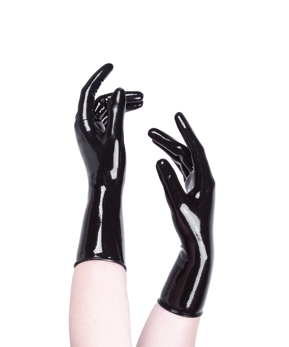 Black glossy gloves worn on a white background