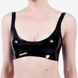 A model is shown wearing a glossy latex basic halter bra, standing in front of a white background.
