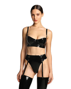 A close-up of a model wearing the black grip latex bra is shown in front of a white background.