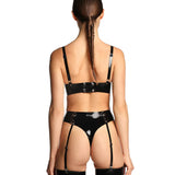 A close-up of the back of a model wearing the black grip latex bra is shown in front of a white background.
