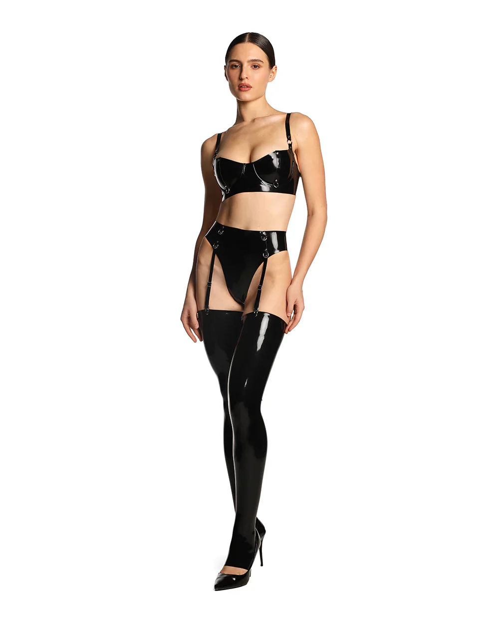 A model wearing the black latex grip garter thong is shown in front of a white background. 