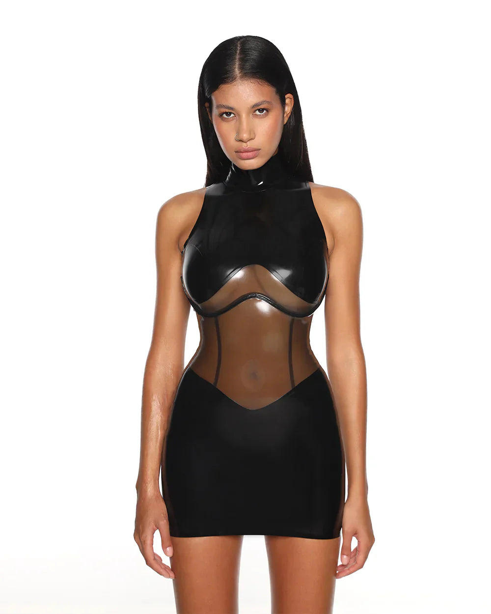 A close-up of a model is shown wearing the black casey latex dress standing in front of a white background.