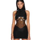 A close-up of a model is shown wearing the black casey latex dress standing in front of a white background.