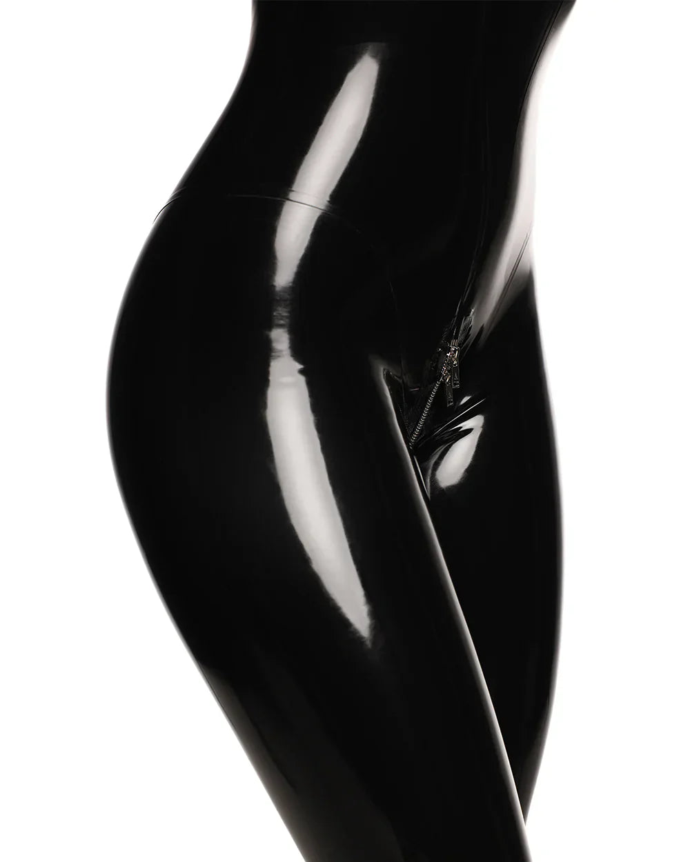 A close-up of waist of a model is shown wearing the black cortex catsuit with zippers standing against a white background.