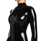 A close-up of the a models upper body is shown in the black kinetic latex catsuit. She is standing in front of a white background. 