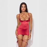 Woman wearing a red strappy outfit on a white background