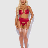 Woman wearing a red lingerie set on a white background