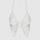 Silver beaded halter top on a light gray background