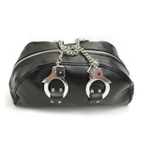 The leather doctor bag with handcuff handles is shown on a white background