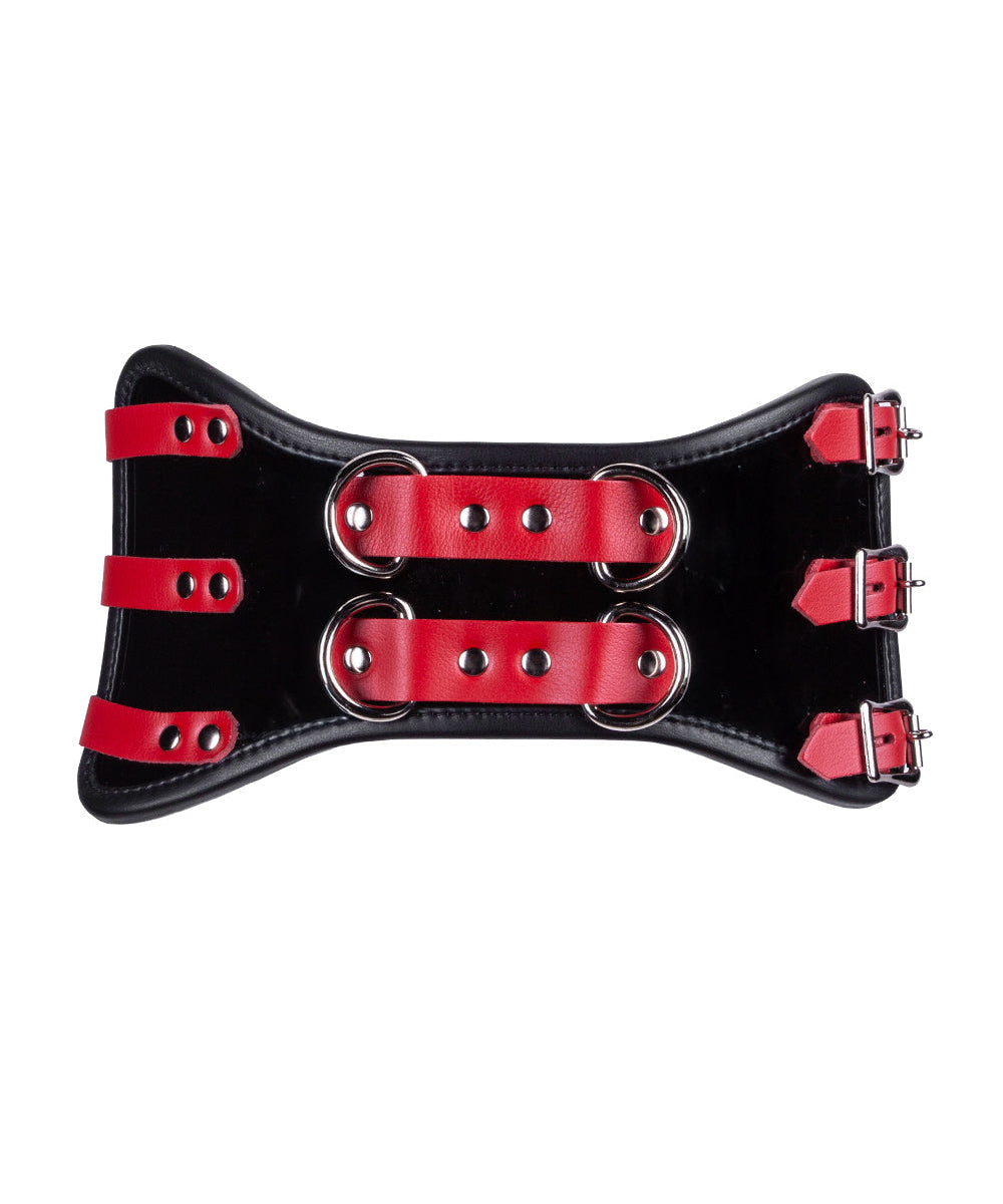 A close-up of the Firecracker Patent Leather Waist Cincher is shown.  3 rows of red buckles connect the edges of the waist cincher.