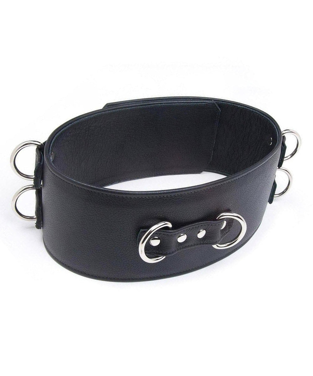 A black Premium Garment Leather Locking Waist Cuff is shown from the back against a blank background. The back of the cuff has two D-rings next to each other, centered in the middle of the cuff.