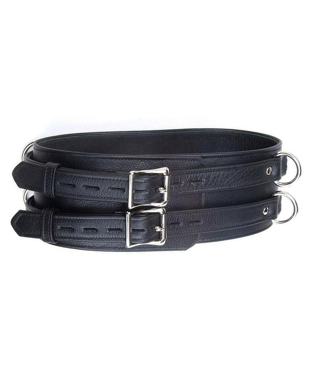 A black Premium Garment Leather Waist Cuff is shown against a blank background. It is made of a thick piece of leather and metal hardware. It has two vertically stacked D-rings on each side and two adjustable straps with locking buckles.