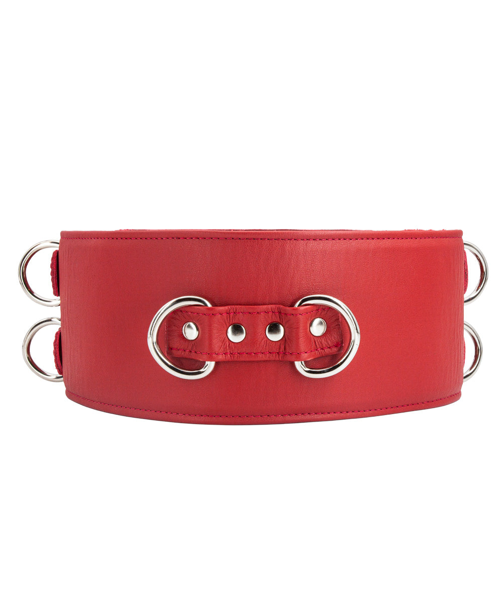A red Premium Garment Leather Locking Waist Cuff is shown from the back against a blank background. The back of the cuff has two D-rings next to each other, centered in the middle of the cuff.