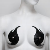 Black and white abstract art piece on a mannequin chest.