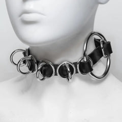 Black and silver choker necklace on a mannequin head against a white background