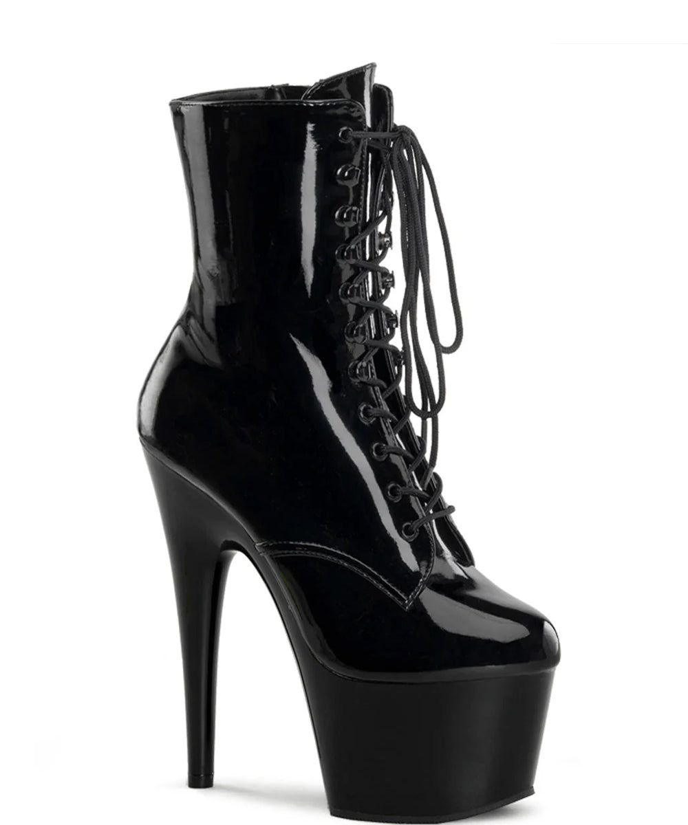 Black patent leather platform boot with high heel on a white background