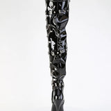 Black patent leather knee-high boot with decorative elements on a white background