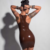 A close-up of a model is shown from the back wearing the Syren cocoa racer front dress