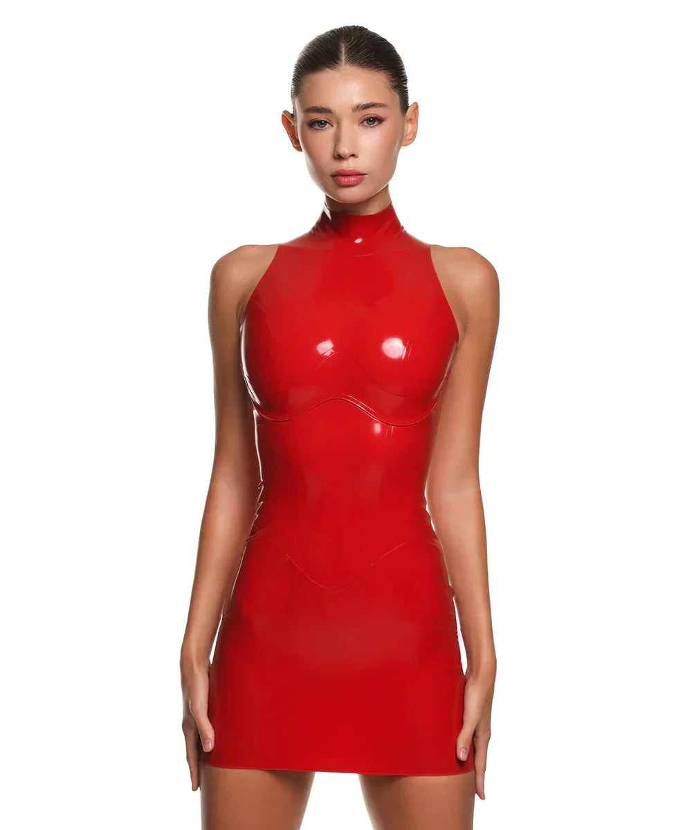 a female model is wearing the casey latex mini dress in red. She is standing in front of a white background. 