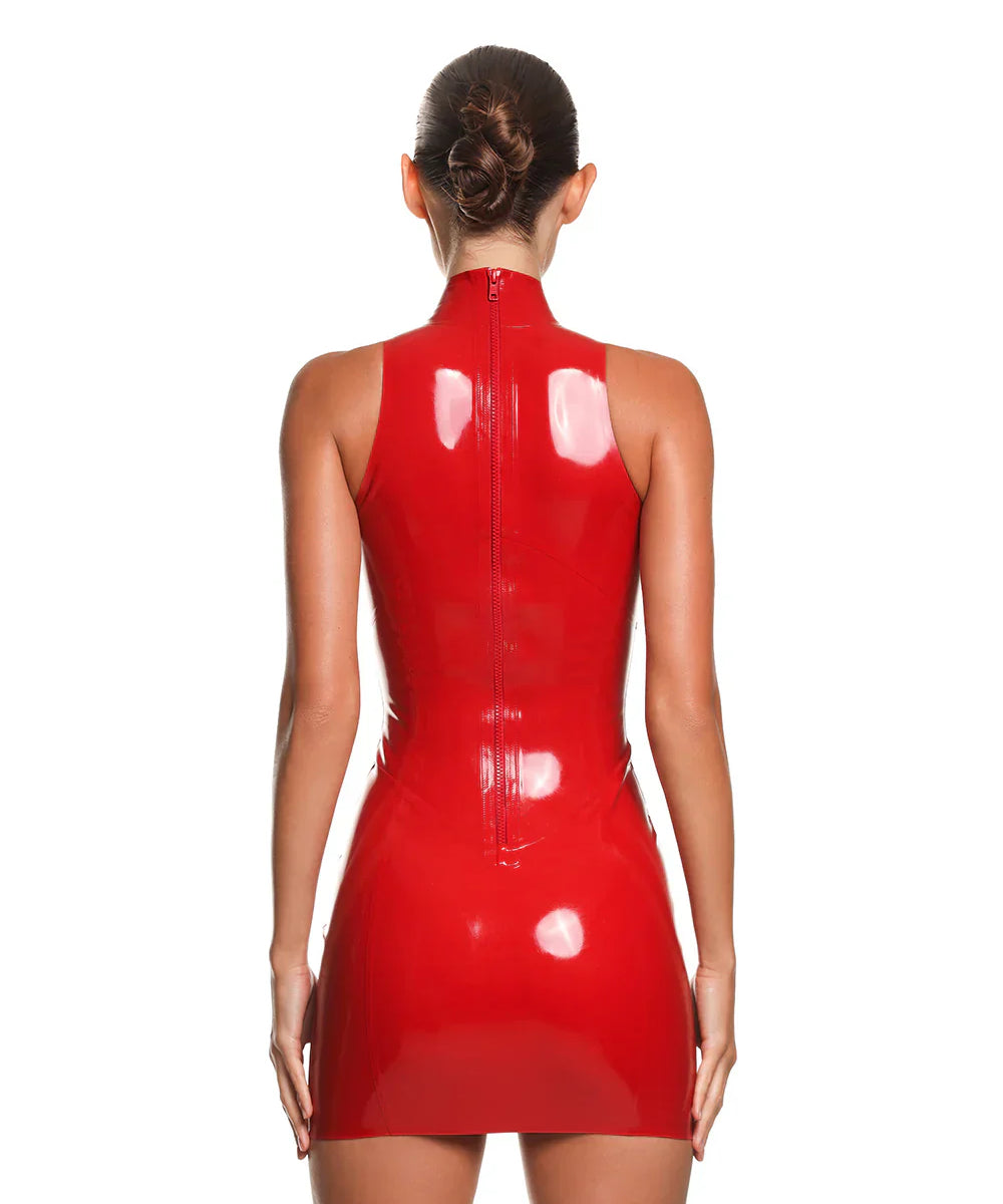 the back of a female model is shown wearing the casey latex mini dress in red. She is standing in front of a white background.