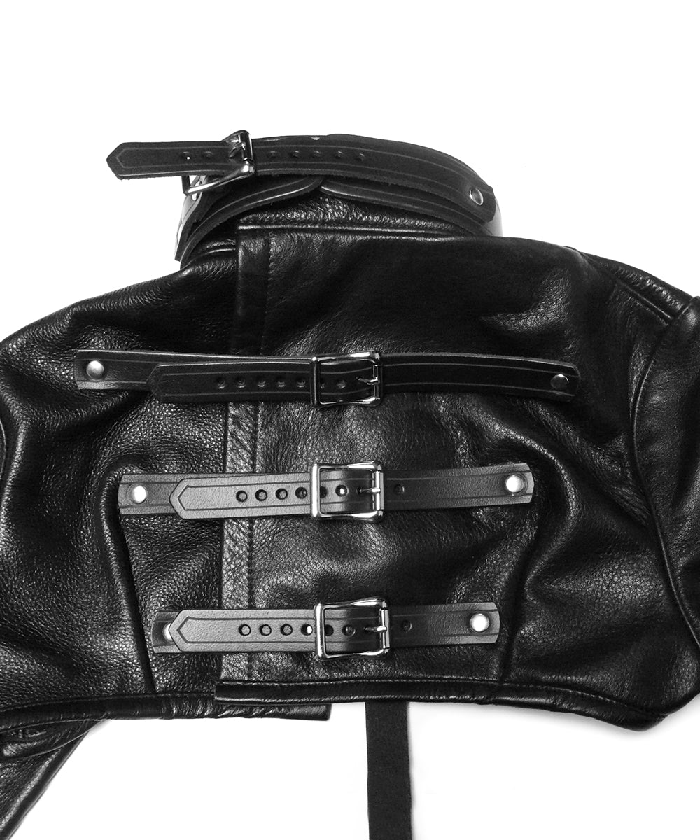 Close-up of a black leather jacket with silver buckles on a white background