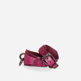 Pink leather wirst cuffs with metal buckle on a white background